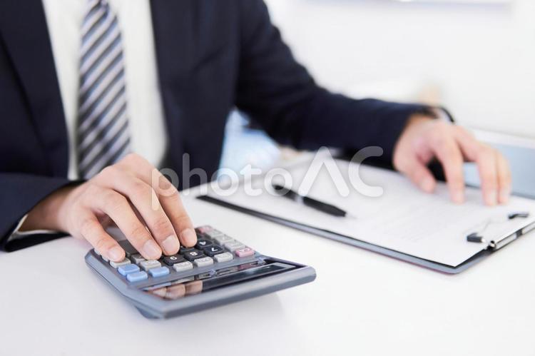 Japanese male businessman doing calculations, tax accountant, calculator, male, JPG
