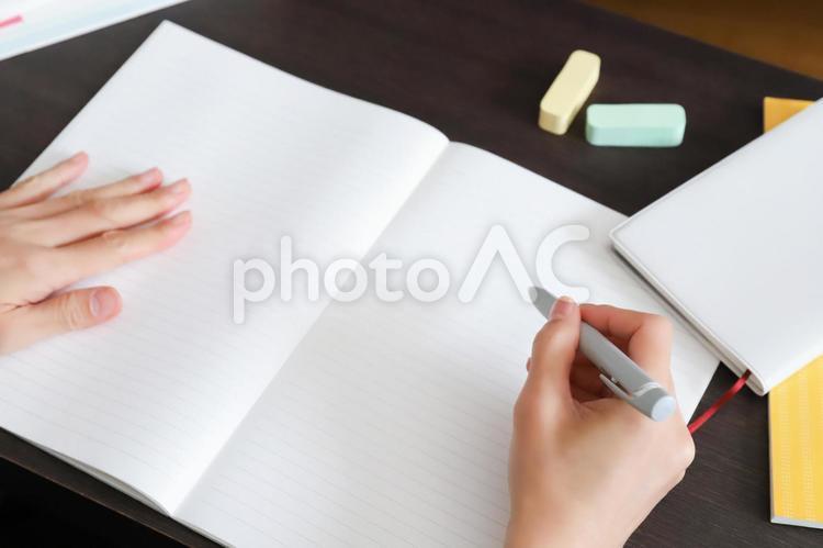 Study image Writing with a pen on a notebook, study, studying for a test, examination grind, JPG
